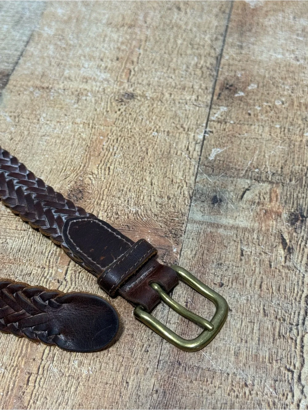Brown leather braided belt size 31 with brass buckle